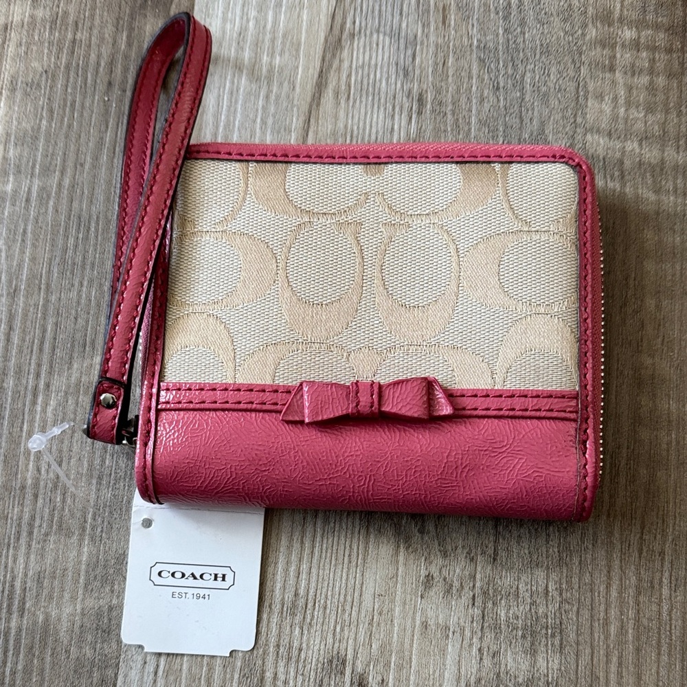 Coach Pink and Tan Bow Zip Around Wristlet Wallet
